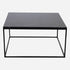 Square Nero Marquina marble coffee table with glossy black surface and subtle scratches, modern design, 80x80 cm.