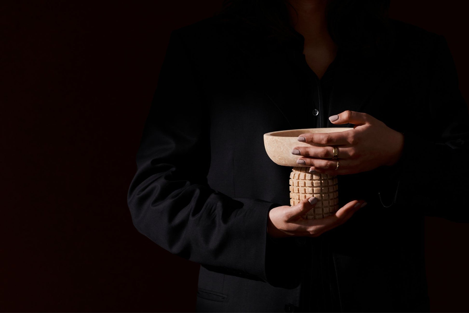 Decorative bowl from ARTIFAKT collection in travertine stone, featuring a smooth, rounded design for elegant home decor.