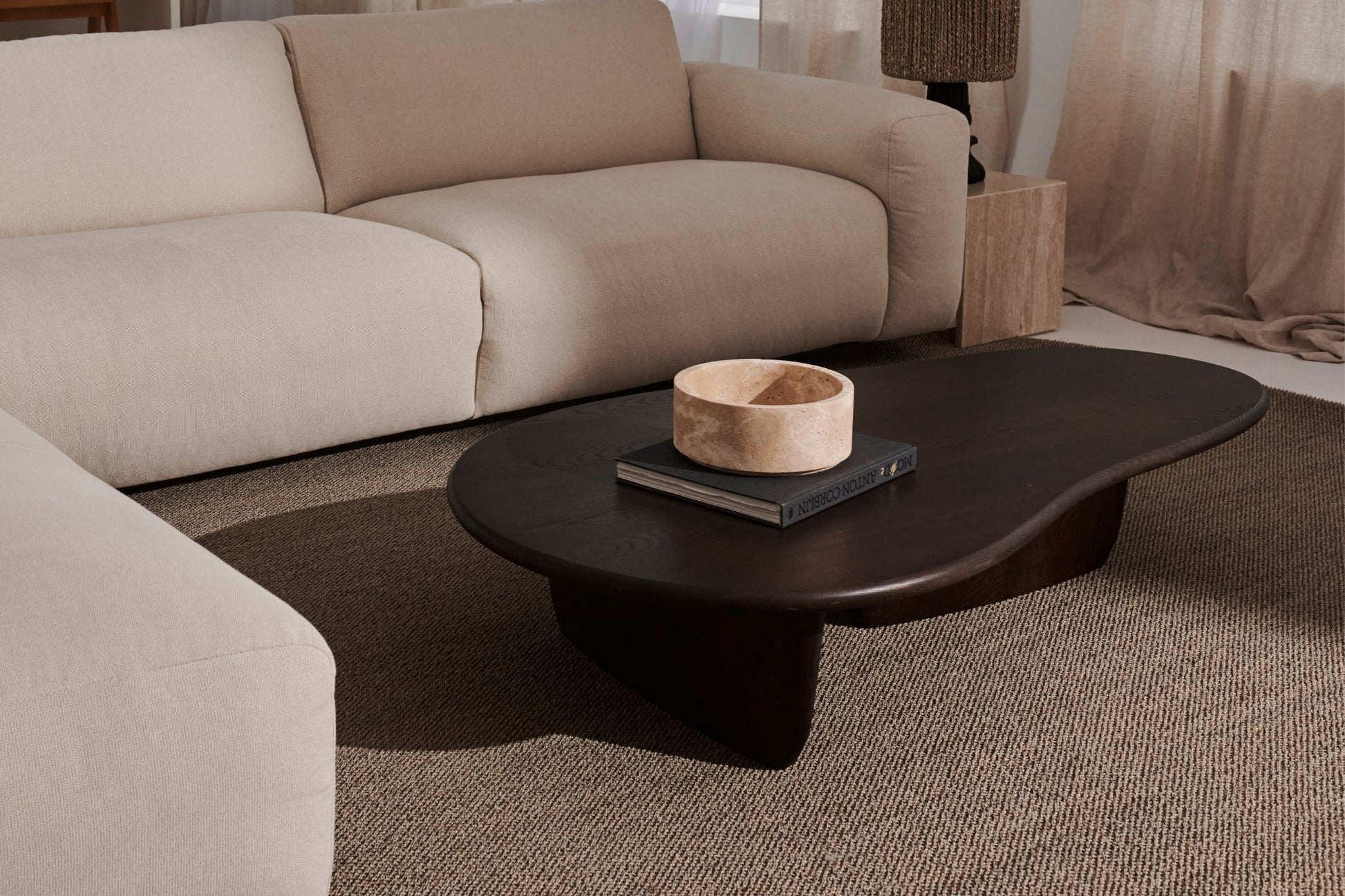 Artifakt Collection fruit bowl made of travertine stone, showcasing a smooth, elegant design for stylish table decor