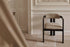Black upholstered dining chair with a sleek design and padded seat from the TRIBUTE collection by My Store.