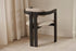 Black upholstered dining chair with a sleek, modern design from the Tribute collection featuring a comfortable seat.