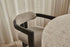 Black upholstered dining chair from the TRIBUTE collection featuring a comfortable seat and sleek design.