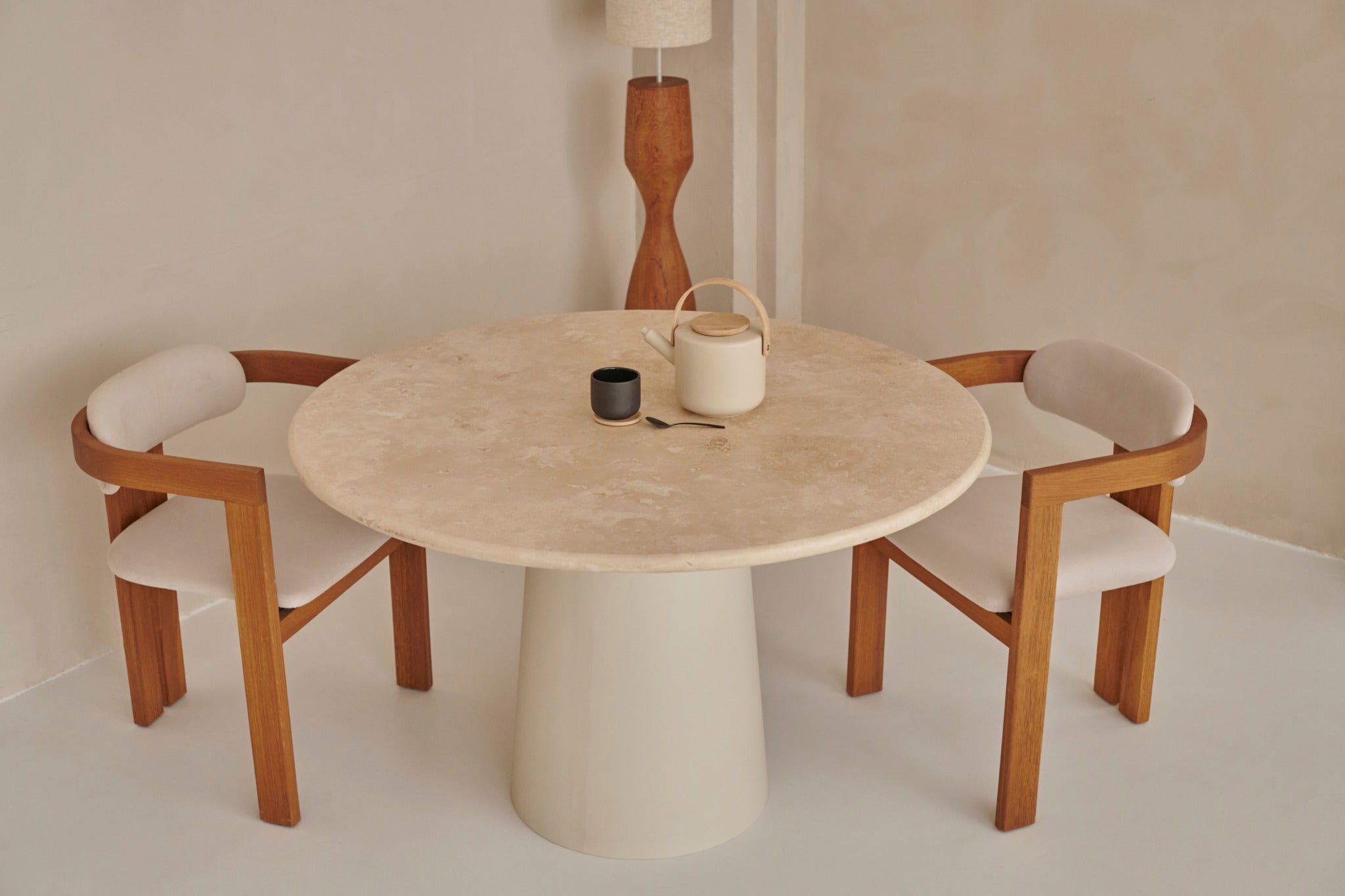 Upholstered off-white dining chair with brown wooden legs from the TRIBUTE collection, showcasing comfortable fabric seating.