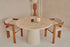 Upholstered off-white dining chair with brown wooden legs from the TRIBUTE collection, showcasing comfortable fabric seating.