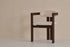 Upholstered off-white dining chair with dark brown legs, modern design, featuring a comfortable seat and sleek style.