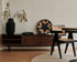 Brown walnut KOMO TV cabinet with sleek design and open shelving, ideal for modern living room entertainment setups.