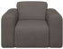 Nollie Monza 97 Clay armchair with plush fabric, modern design, and wooden legs, displayed in a contemporary living room setting.