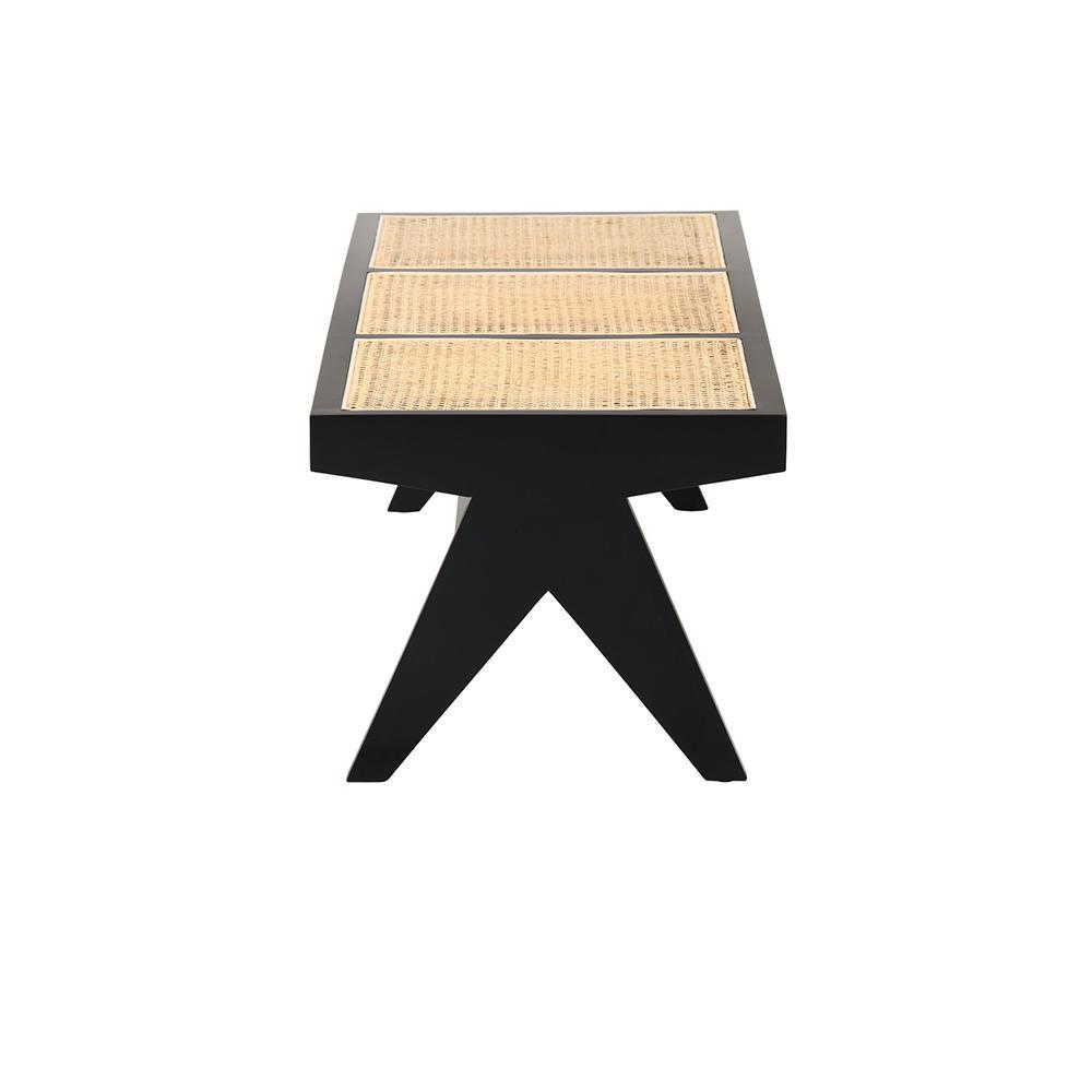 Black rattan bench named Pierre with a sturdy frame and woven seat, ideal for indoor or outdoor seating.