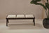 Dark brown rattan bench with upholstered seat named Pierre, featuring a stylish and comfortable design for living spaces.