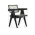 Black rattan dining chair named Pierre, with a sleek design and sturdy frame, perfect for modern dining rooms.