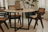 Dark brown rattan dining chair with upholstered seat, model Pierre, showcasing a stylish and comfortable design.