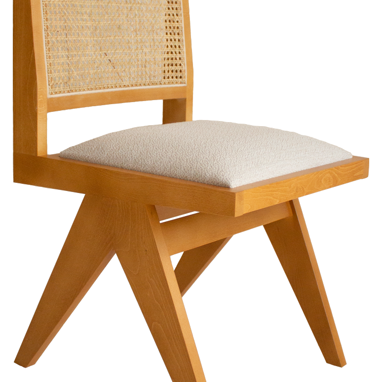 Brown rattan dining chair with upholstered seat, Pierre brand, sleek armrest-free design for stylish dining room seating.