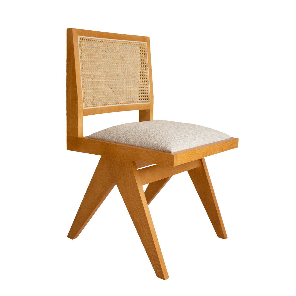 Brown rattan dining chair with upholstered seat and no armrests, model Pierre, designed for stylish, comfortable dining spaces.