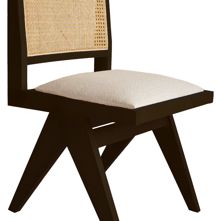Dark brown rattan dining chair with upholstered seat and no armrests, model Pierre, suitable for modern dining room decor.