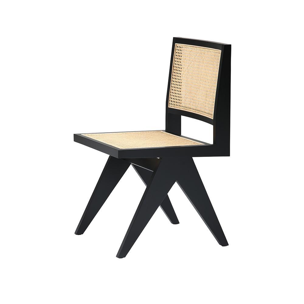 Black rattan dining chair without armrests, model Pierre, showcasing a sleek, modern design perfect for contemporary dining rooms.