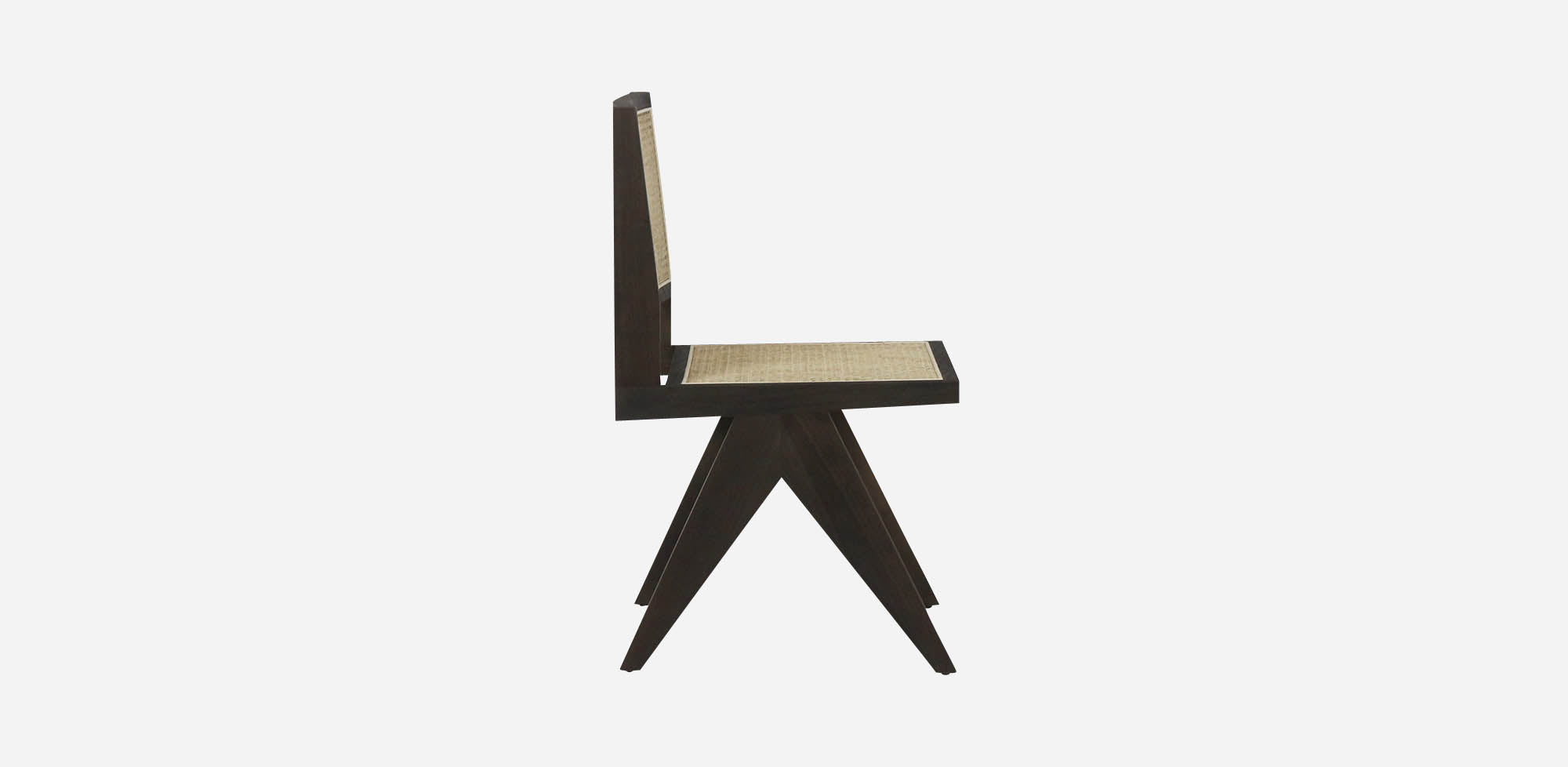 Dark brown rattan dining chair without armrests, model Pierre, showcasing woven rattan design and sturdy wooden legs.