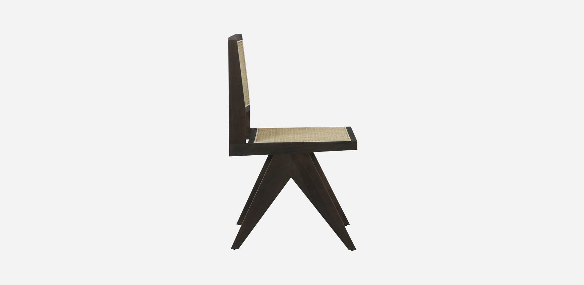 Dark brown rattan dining chair without armrests, model Pierre, showcasing woven rattan design and sturdy wooden legs.