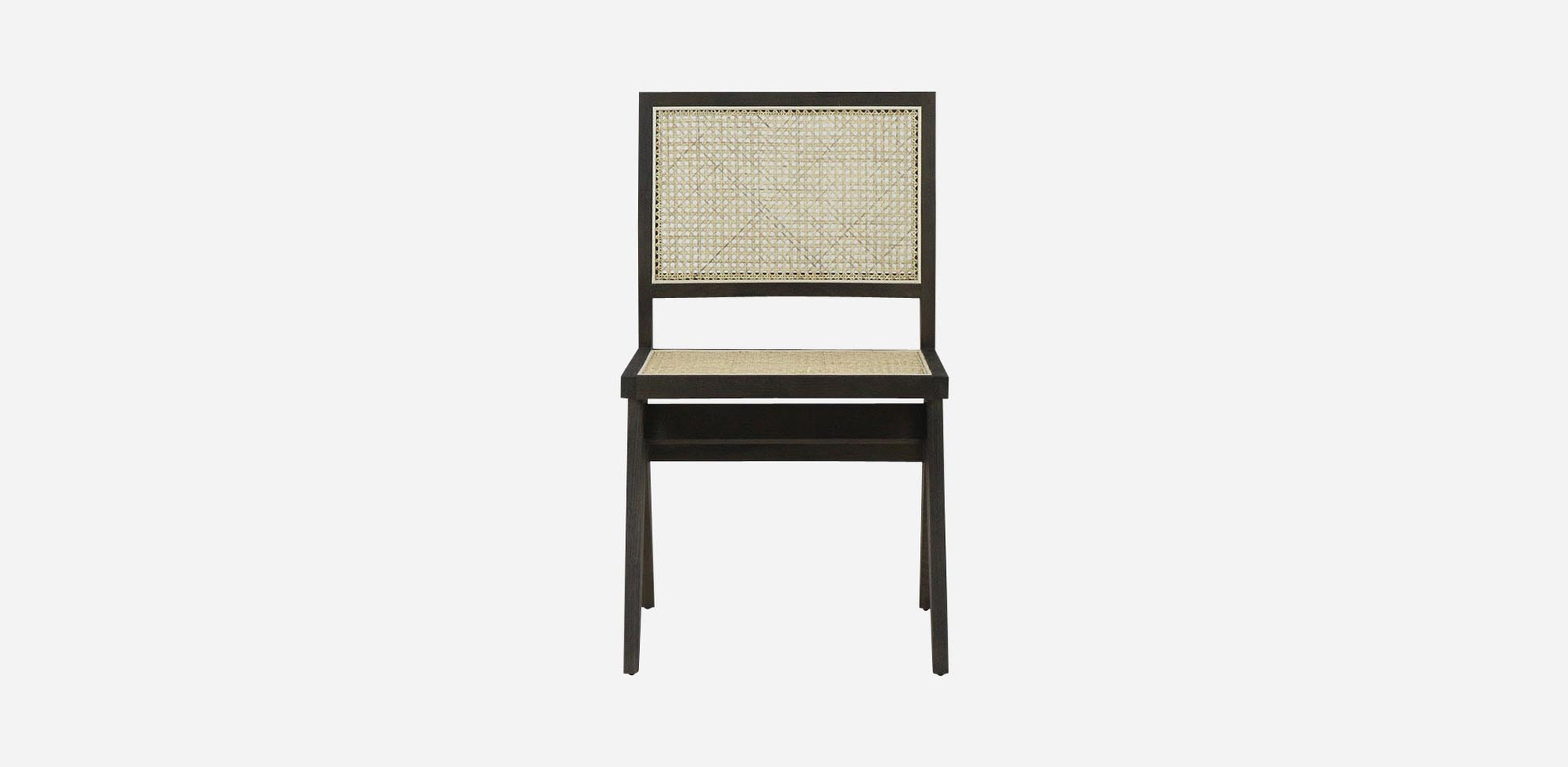 Dark brown rattan dining chair without armrests, model Pierre, showcasing a stylish and modern design for dining room decor.