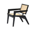 Black rattan fauteuil Pierre by My Store featuring a stylish, curved design with plush cushions for comfortable seating.