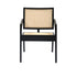 Black rattan fauteuil named Pierre with a modern design, featuring a woven rattan seat and backrest for stylish comfort.