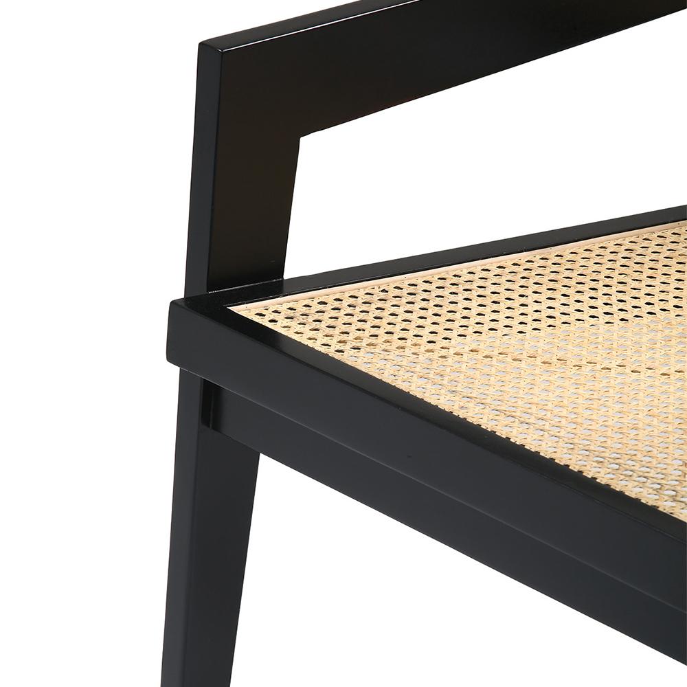 Black rattan fauteuil Pierre by My Store featuring a stylish, curved design and comfortable armrests.