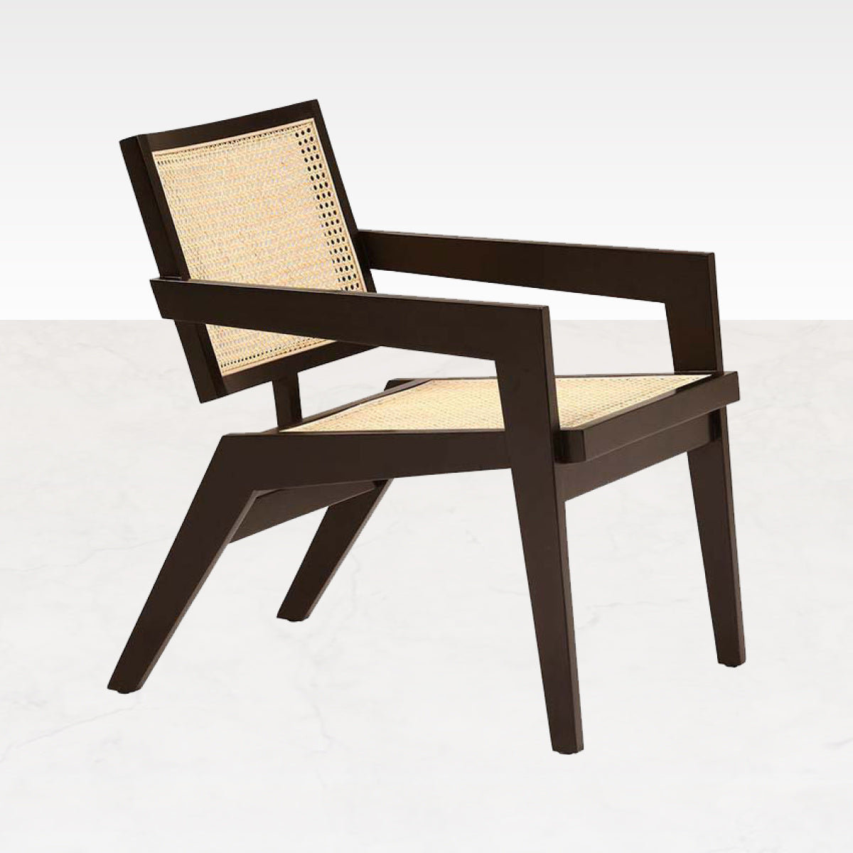 Dark brown rattan fauteuil named Pierre featuring a stylish, curved design for comfortable seating and elegant home decor.