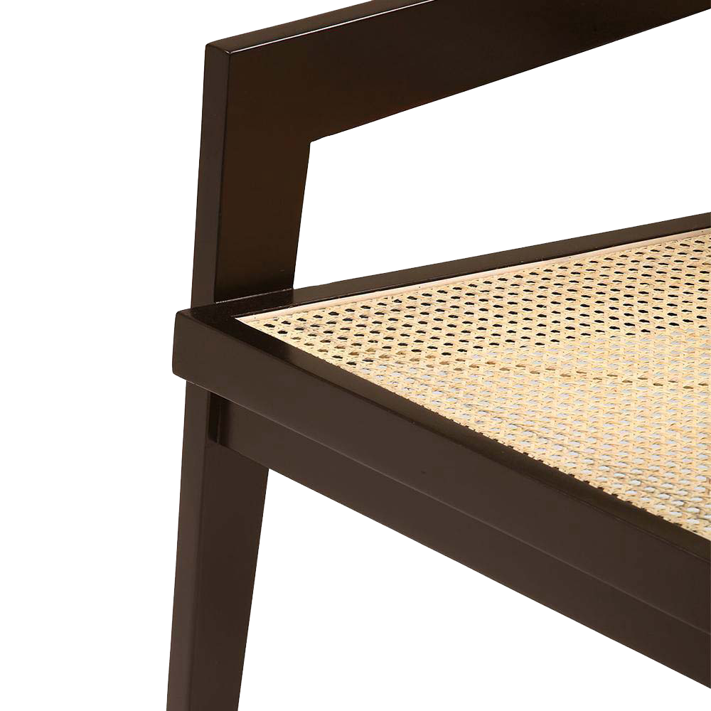 Dark brown rattan fauteuil chair named Pierre with a woven design, showcasing natural rattan texture and sturdy frame.