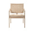 Natural rattan fauteuil named Pierre with curved armrests and woven design, showcasing a stylish and comfortable lounge chair.