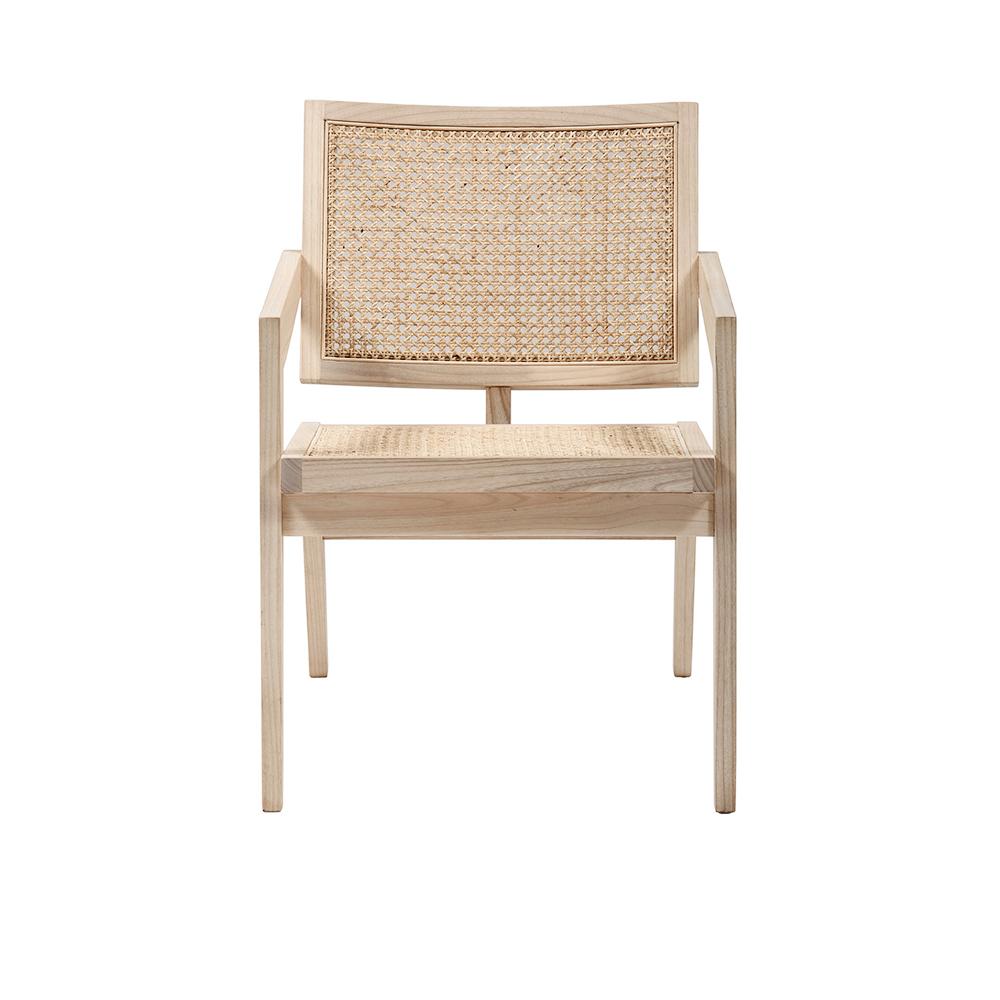 Natural rattan fauteuil named Pierre with curved armrests and woven design, showcasing a stylish and comfortable lounge chair.