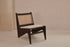Dark brown rattan kangaroo chair with upholstered seat in the Pierre style, featuring a cozy and stylish design.