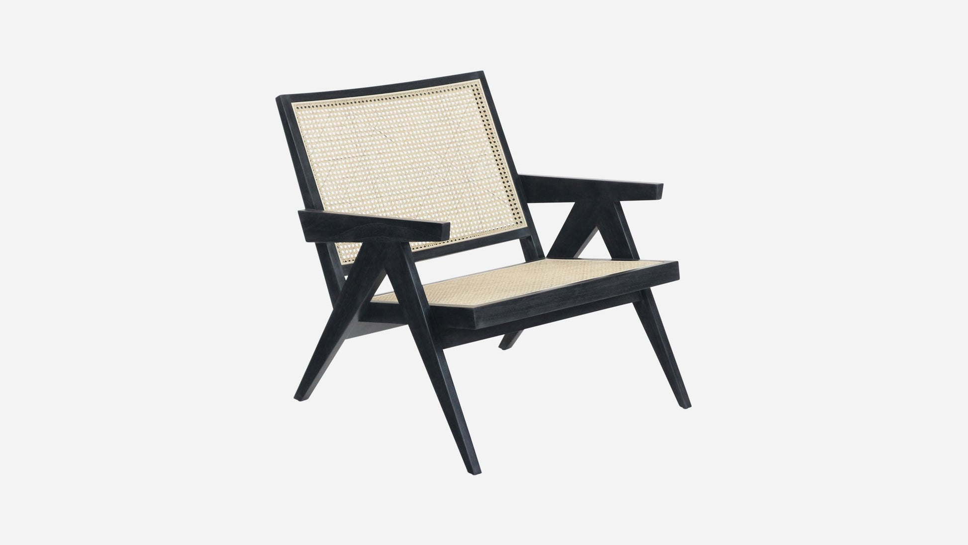 Black rattan lounge chair named Pierre with a modern design, featuring a sturdy frame and comfortable seating.