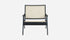Black rattan lounge chair named Pierre with a modern design, suitable for indoor or outdoor relaxation spaces.