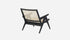 Black rattan lounge chair named Pierre with a modern design, featuring a sturdy frame and comfortable seating.
