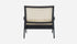 Black rattan lounge chair named Pierre with a modern design, featuring a sturdy frame and comfortable seating.