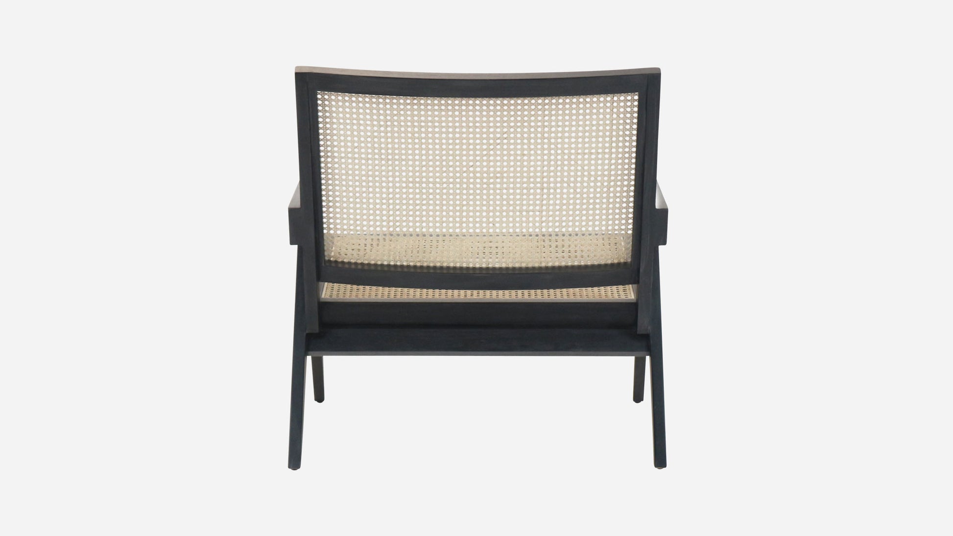 Black rattan lounge chair named Pierre with a modern design, featuring a sturdy frame and comfortable seating.