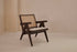 Dark brown rattan lounge chair with upholstered seat from Pierre collection, stylish and comfortable indoor or outdoor seating.