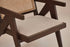 Dark brown rattan lounge chair with upholstered seat, modern Pierre design for comfortable outdoor or indoor relaxation.