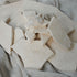 Sample travertine tile from My Store showing beige, textured stone surface with natural veining and porous finish.