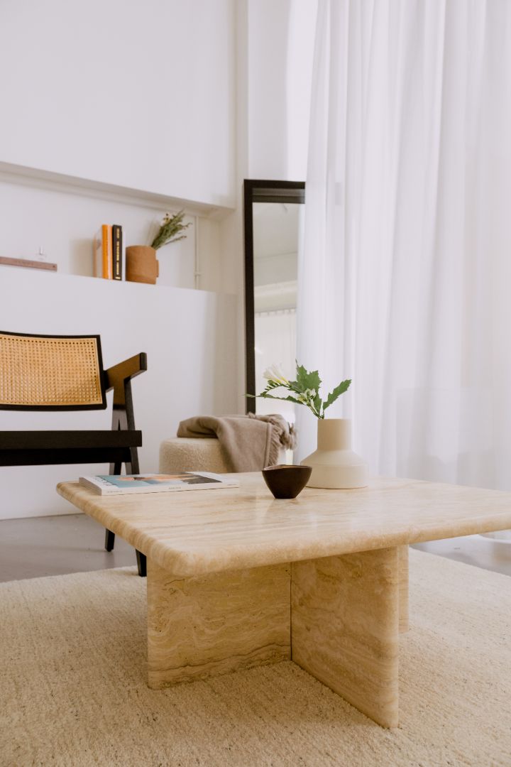Elegant travertine coffee table with a smooth surface and sturdy base, perfect for modern living room decor.