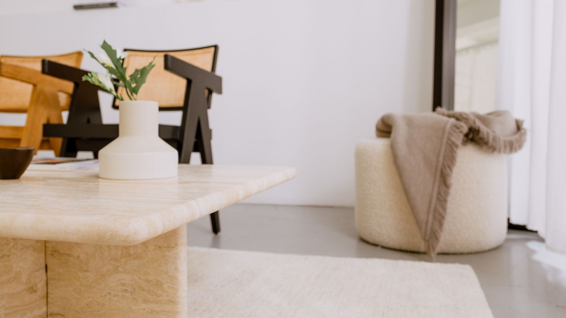 Travertine coffee table with a smooth, polished surface and sturdy base, showcasing elegant natural stone design.
