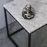 Glossy Bianco Carrara marble side table with sleek white finish, showcasing elegant natural veining and modern design.