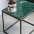 Glossy India Green marble side table with sleek design, perfect for modern living spaces.