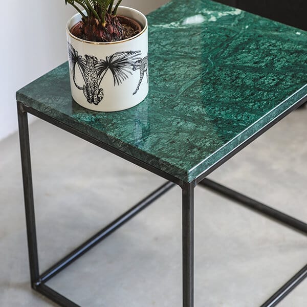 Glossy India Green marble side table with sleek design, perfect for modern living spaces.