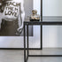 Glossy Nero Marquina marble side table with sleek black finish, modern design, and round shape for stylish home decor.
