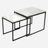Set of two glossy Bianco Carrara white marble side tables with sleek, modern design and round tabletops.