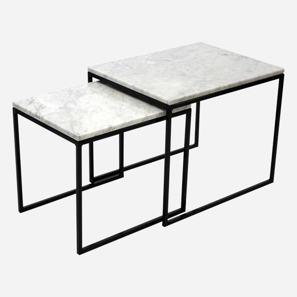 Set of two glossy Bianco Carrara white marble side tables with sleek, modern design and round tabletops.