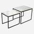 Set of two glossy Bianco Carrara white marble side tables with sleek, modern design and round tops.
