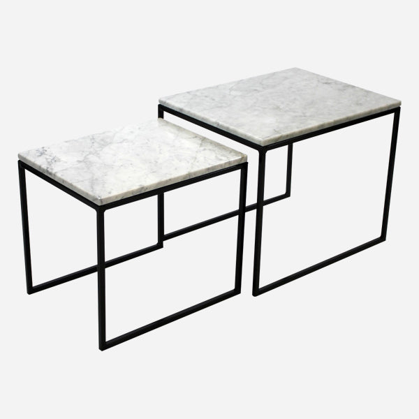 Set of two glossy Bianco Carrara white marble side tables with sleek, modern design and round tops.