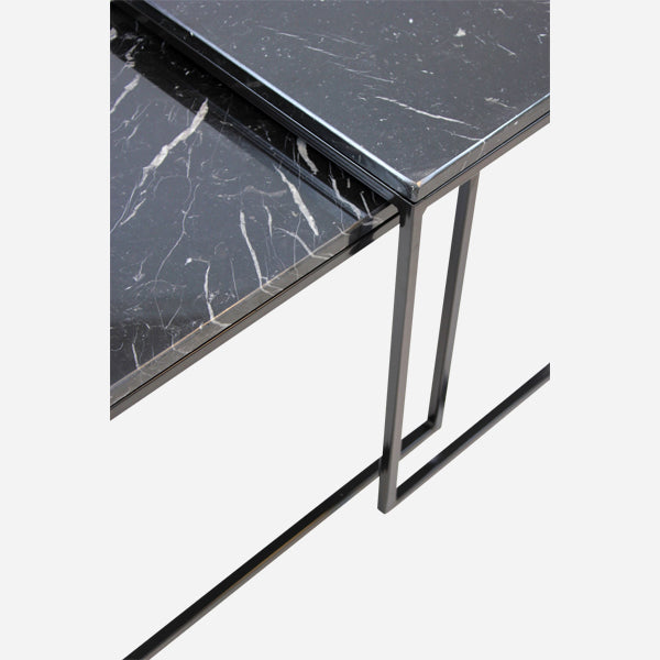 Set of two Nero Marquina black marble side tables with glossy finish, modern design, and round tops.