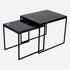 Set of two Nero Marquina black marble side tables with glossy finish, modern design, and sleek black surface.